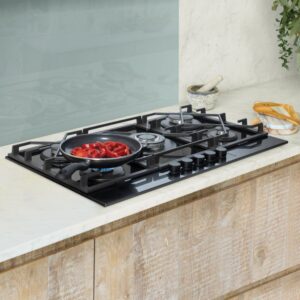 Gas hob repairs on a four-burner stainless steel hob